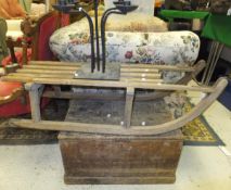 A wooden sledge, a small pine box stamped "J S Collins" to the lid and a wrought metal candelabra