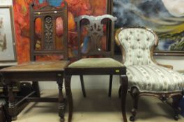 A Victorian carved walnut framed salon chair in Regency striped upholstery, together with a late