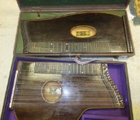 An Anton Kiendl, Wien, guitar zither, housed in a black carrying case, together with another Anton