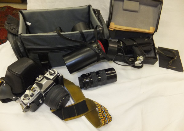 A Chinon 809 Power Zoom cine camera, a Miranda camera bag, containing a collection of camera