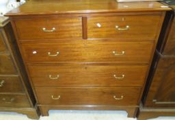 A mahogany chest of two short and three long graduated drawers