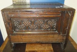 An 18th century and later small oak coffer with carved decoration