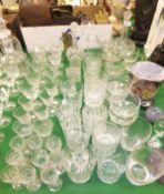 A collection of assorted glassware to include decanter, tumblers, wine glasses, coloured studio