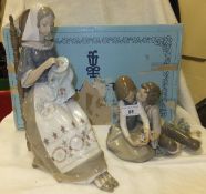 A large Lladro porcelain figure "The Embroiderer", No'd. E14M (boxed), together with a Lladro