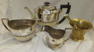 An electro-plated teapot, sugar bowl and cream jug, together with a brass pestle and mortar