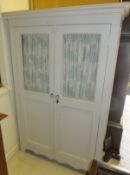 A French pale grey painted wardrobe/cupboard in the French taste with mesh and panelled doors, bears