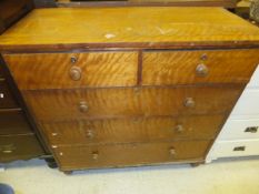 A Victorian satinwood veneered chest of two short and three long graduated drawers on turned feet