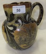 A Doulton Lambeth stoneware jug decorated with goats, by Hannah Barlow, monogrammed and No'd.