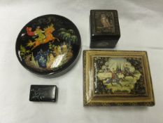 Three lacquered boxes to include two signed Russian examples, together with a small 19th Century