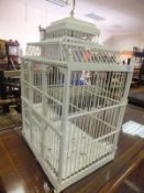 A white painted decorative birdcage