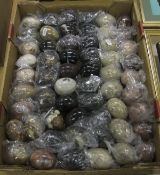 A collection of 57 various stone eggs