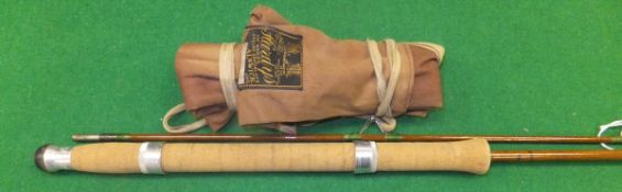 A Hardy "Wanless" 7 ft. two piece greenheart spinning rod, with makers cloth bag