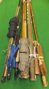 A collection of six assorted fishing rods - a Daiwa carbon spinning rod, Shakespeare "Purist" carbon