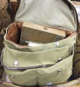 A canvas fisherman's bag containing a Leeda rimfly with spare spool, Shakespeare Beaulite fly reel