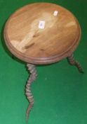 A tripod table, the circular mahogany top raised on three Black Buck horn legs   CONDITION