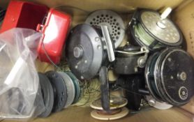 A collection of assorted fishing tackle to include fly reels, fixed spool reel, spinning baits and