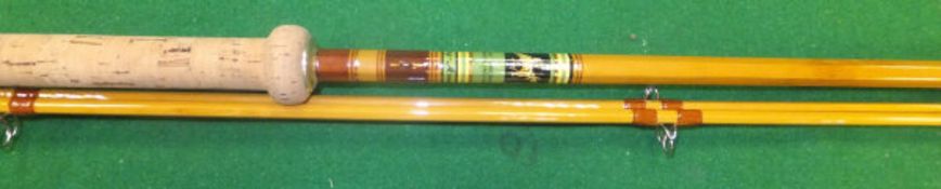 An Allcocks "Carp-Avon" two piece split cane fishing rod, with spare tip, the tips marked