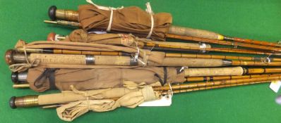 A collection of five assorted split cane salmon spinning rods
