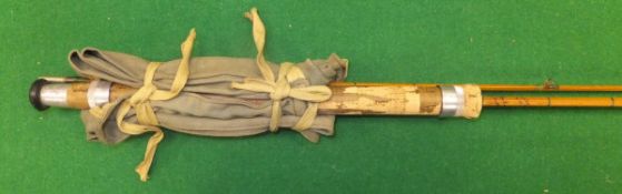 A Hardy "Wanless" 7 ft. two piece split cane spinning rod, with makers cloth bag