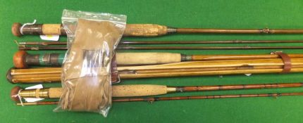 Three vintage fishing rods to include an example by Milwards, one un-named two piece greenheart rod,