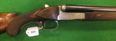 A Winchester Model 23 12 bore shotgun, pigeon grade, double barrel, side by side, box lock, single