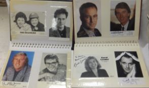 Two volumes of approximately 150 signed publicity photo cards, various artists, actors and TV stars,
