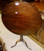 An early 19th Century mahogany occasional table, the circular snap top on baluster turned and ringed