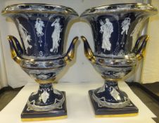 A pair of modern porcelain vases on a blue ground in the Greco-Roman style   CONDITION REPORTS