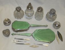A collection of three silver mounted cut glass dressing table bottles, together with a heart