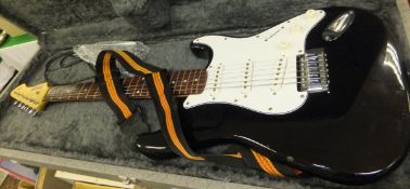An electric six string Rockwood by Hohner guitar with black body, in hard case, together with a