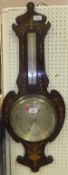 A rosewood aneroid barometer with decorative foliate inlay