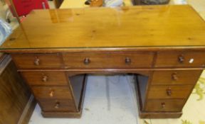 A Victorian mahogany double pedestal desk with three drawers raised on two banks of three drawers