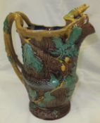 A large majolica jug decorated with snake, acorn leaves and frog   CONDITION REPORTS  Damage to nose