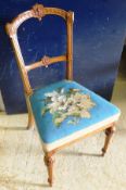 A set of three Victorian walnut framed salon chairs with beadwork upholstered seats on turned and