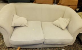 A modern upholstered two seat scroll arm sofa