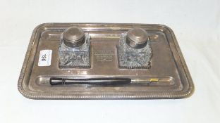 A 20th century silver plated desk standish with cut glass bottles, inscribed "Lt. Col SJM. Jenkins