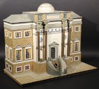 A large Georgian style dolls house with two sweeping external staircases to main entrance flanked by