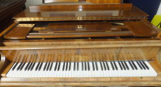 An early 20th Century mahogany cased baby grand piano, the iron framed overstrung movement by