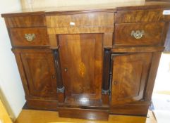 A Continental mahogany breakfront chiffonier in the Regency taste