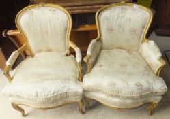 Two early 20th Century painted framed and upholstered fauteuils in the Louis XV taste