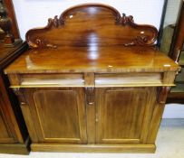 A Victorian mahogany chiffonier, the raised back above two drawers over two panelled doors to a