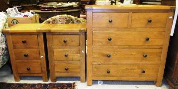 A modern oak chest of two short and three long drawers, and a matching pair of three drawer