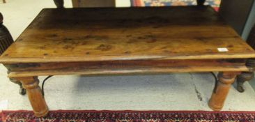A rectangular Indian hard wood coffee table with metal banding