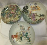 Two Chinese porcelain shallow dishes decorated in the famille-rose palette with figures and