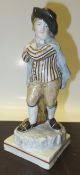 A circa 1800 Staffordshire pearlware figure of a gentleman in cape   CONDITION REPORTS  Various