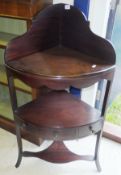 A late George III mahogany corner wash stand with bowl recess over a single drawer to splayed