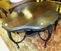 An Edwardian mahogany occasional table, the shaped top with decorative frieze on cabriole legs