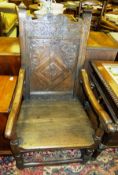 An oak wainscot chair, the carved back above a plain seat on ringed and turned supports united by