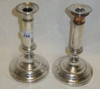 A pair of 19th Century Sheffield plate candlesticks on circular bases, stamped "D*S" to base