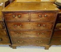 A late George III mahogany chest, the moulded edge top over two short drawers and three long drawers